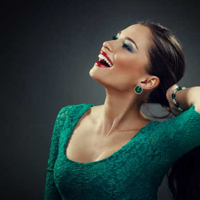 A woman with makeup on her face and green dress · Free Stock Photo